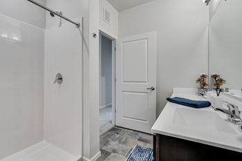 Bathroom With Walk-In Shower With Tile Flooring
